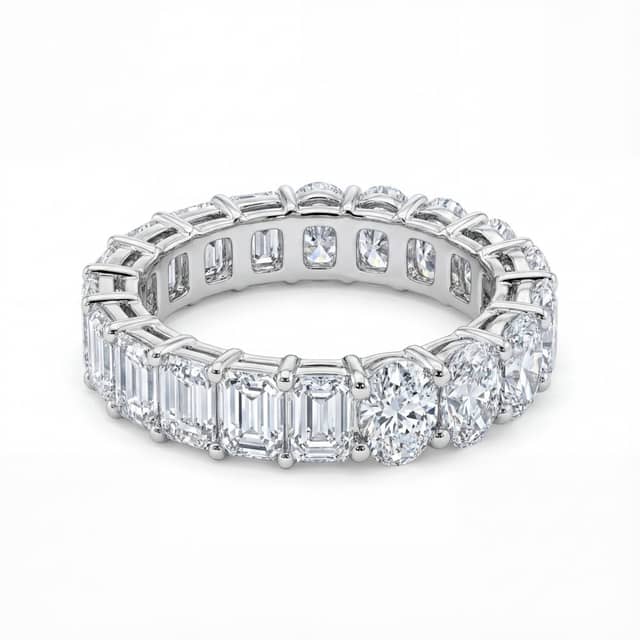 Eternity band set with emerald-cut lab-grown diamonds around one half and oval lab-grown diamonds around the other