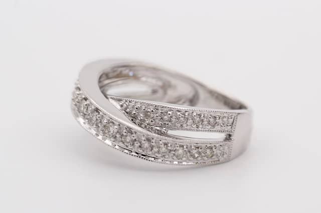 White gold crossover band with two rows of pavé-set stones