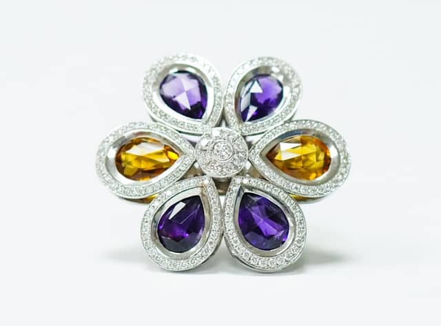 Custom white gold flower ring set with pear-shaped amethysts and citrines